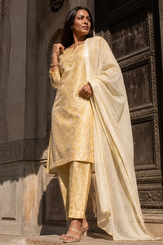 Gold-tinged yellow brocade kurti with straight pants