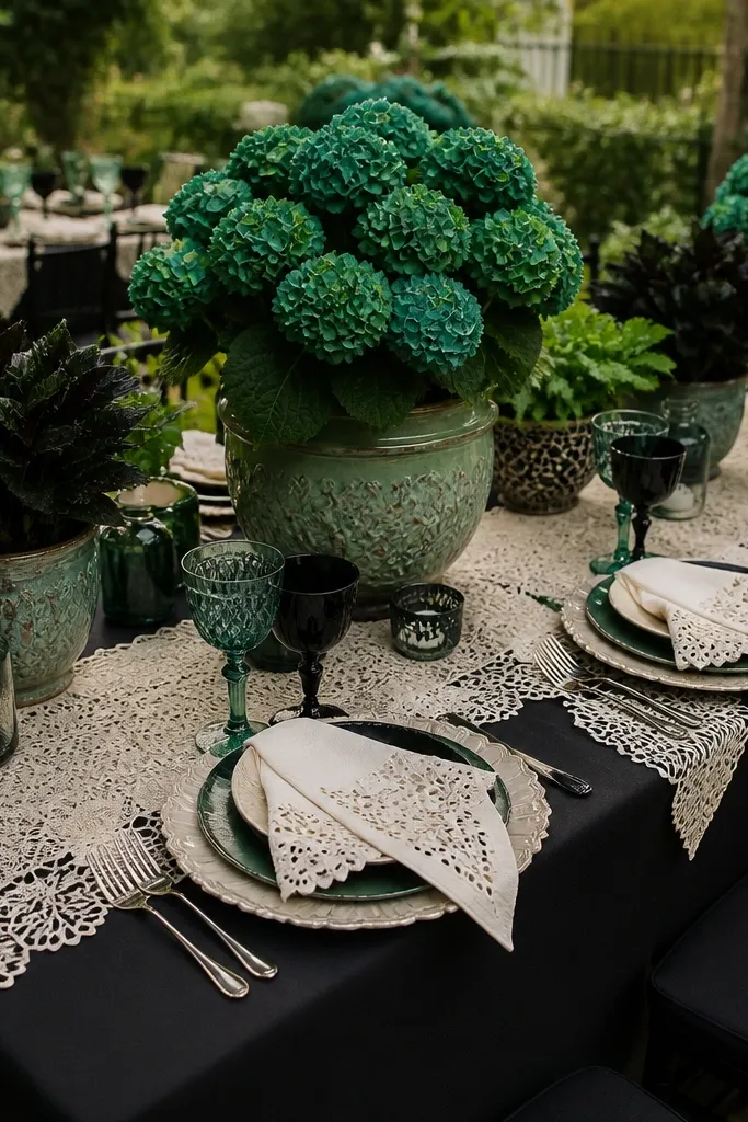 Black linens with emerald green bouquets and white lace details