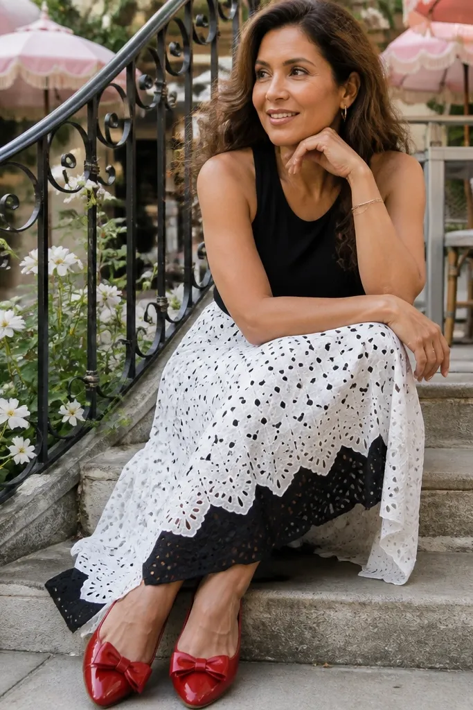 Black and white eyelet midi skirt with a simple black top and red flats