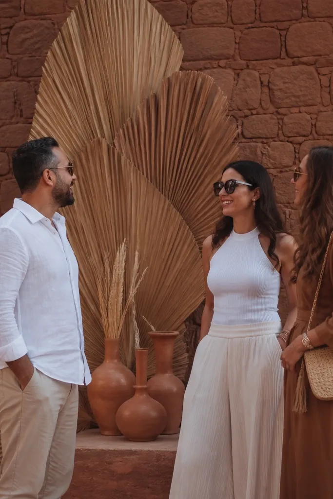 Dried palm fan backdrop against warm brick tones near entrance