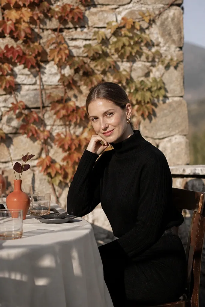 Persimmon bridesmaid dresses with charcoal suits and warm ivory table linens