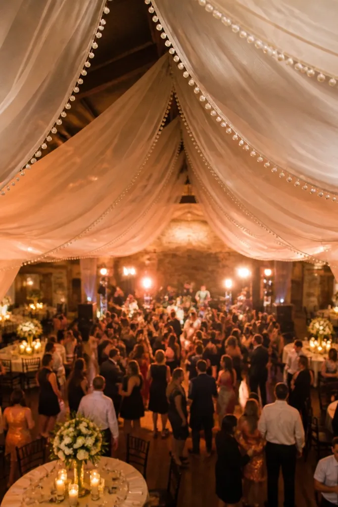 Chiffon canopy with pearl trim hanging above the dance floor