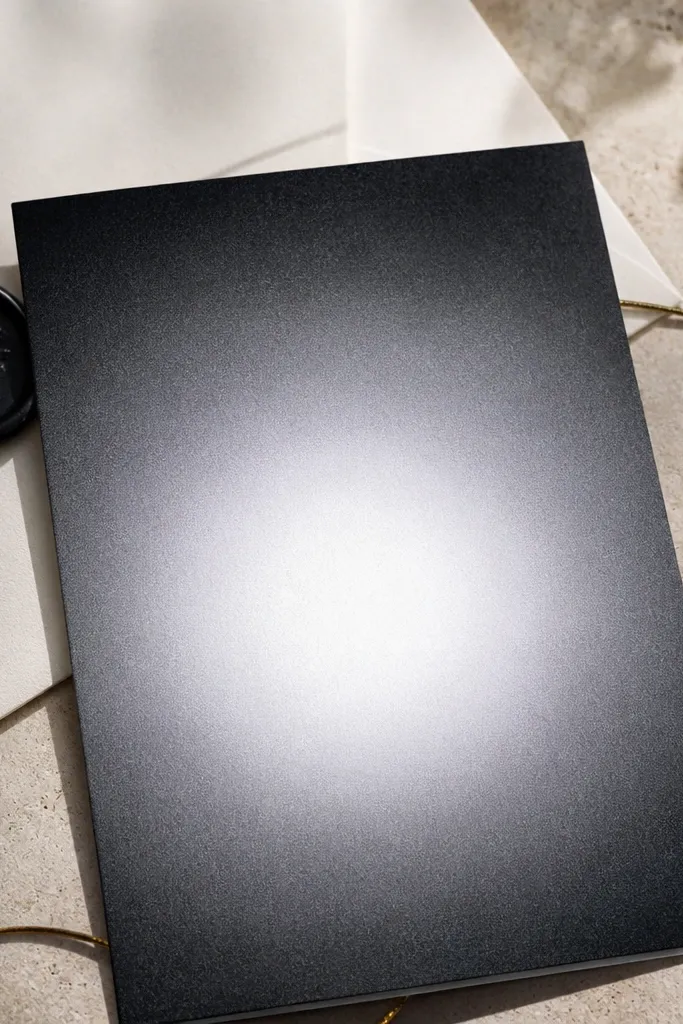 Dark charcoal to gray gradient with a lighter circular glow in the middle.