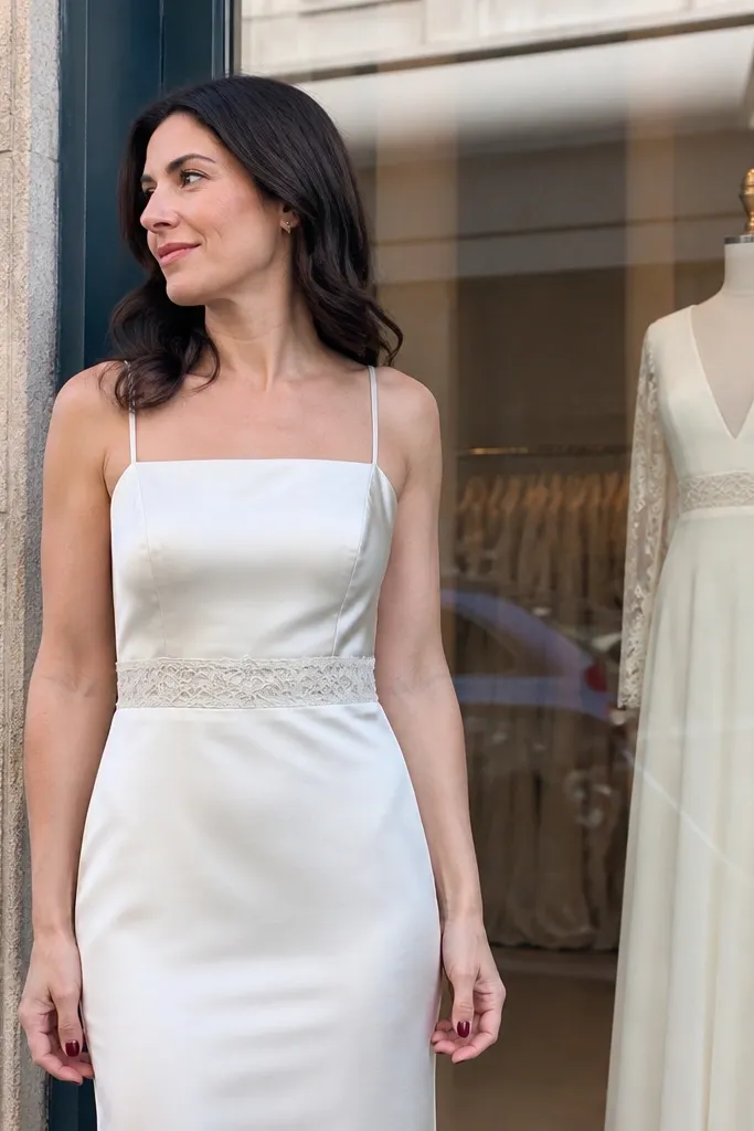 Ivory satin straight-neck dress with a lace-trimmed waistband