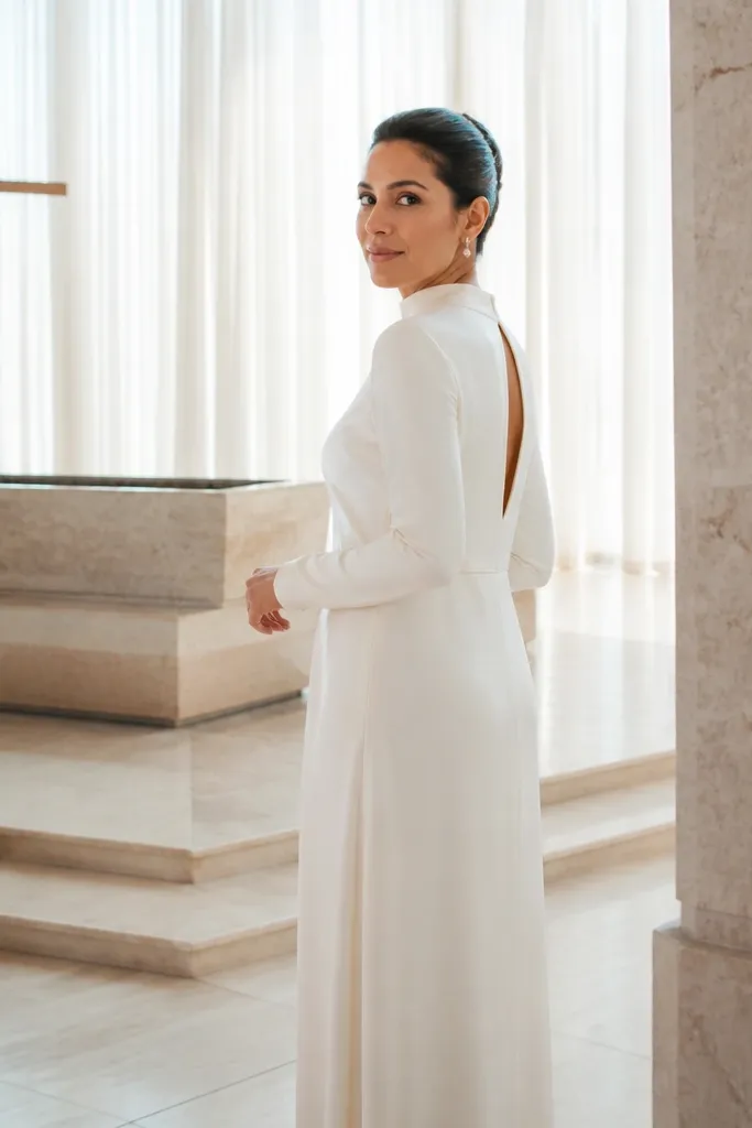 Ivory silk crepe high-neck dress with a keyhole opening at the back