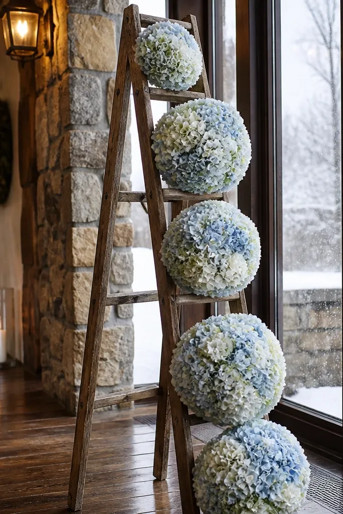 Wooden ladder frame with tall hydrangea pomanders on a wedding stage